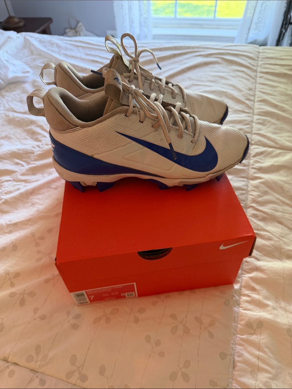 Nike White and Blue Cleats with Bold Heel Branding